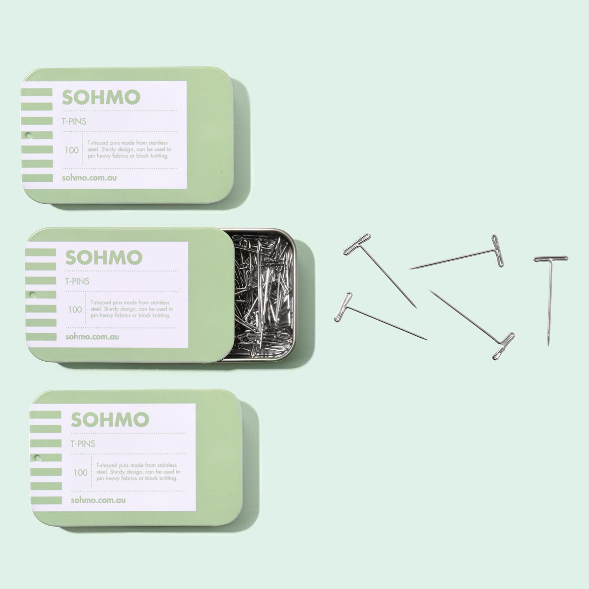 A green tin of SOHMO T Pins for blocking knitting, pinning wigs or working with extra heavy fabrics.