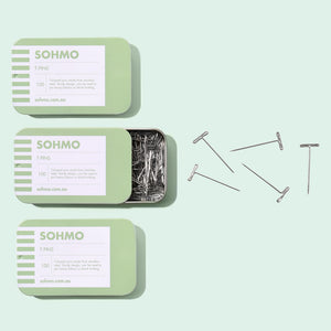 A green tin of SOHMO T Pins for blocking knitting, pinning wigs or working with extra heavy fabrics.