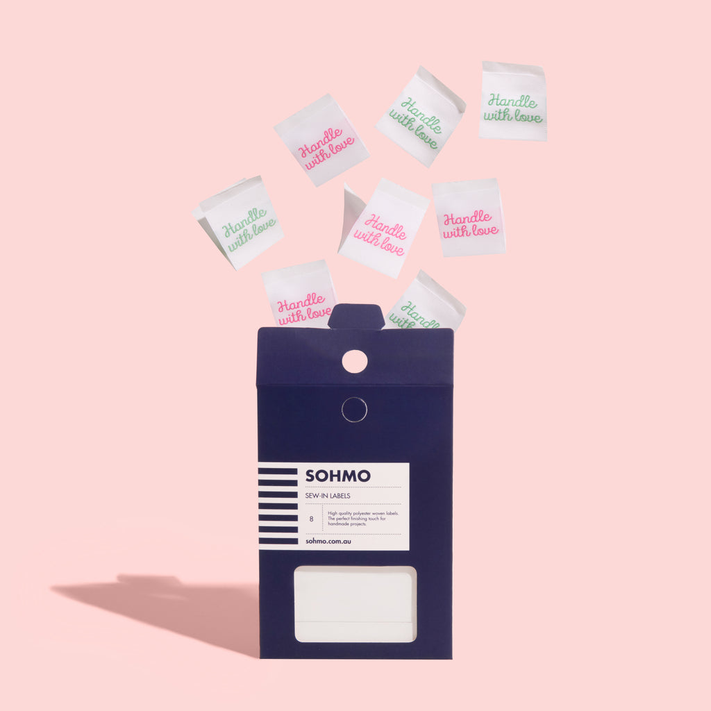 A pack of SOHMO 'handle with love' sew-in clothing labels