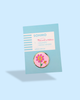 A round enamel needle minder with gold back